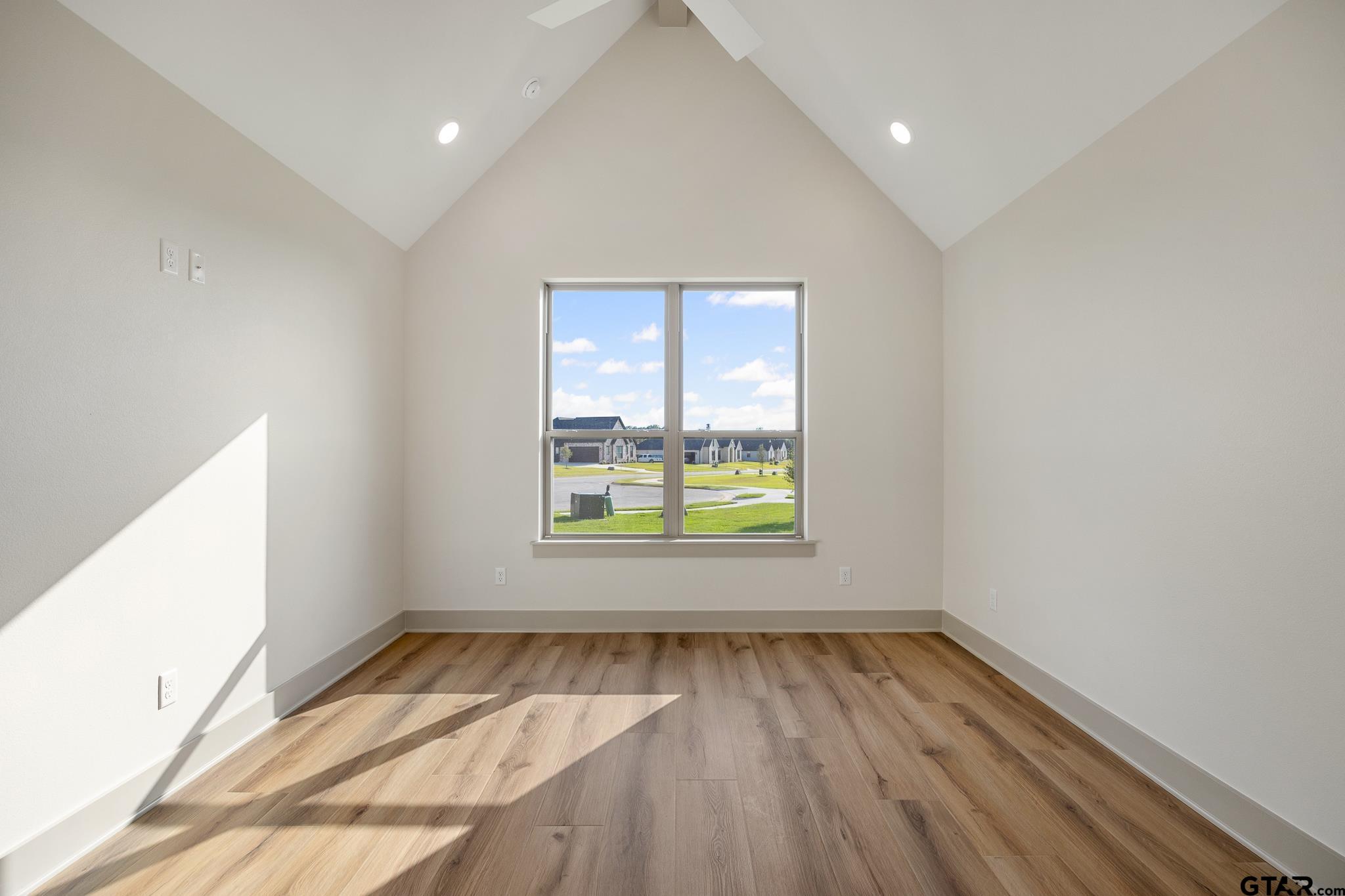 11410 Tucker Circle Flint, TX 75762 - Photo 36 of 43 an empty room with wooden floor and windows