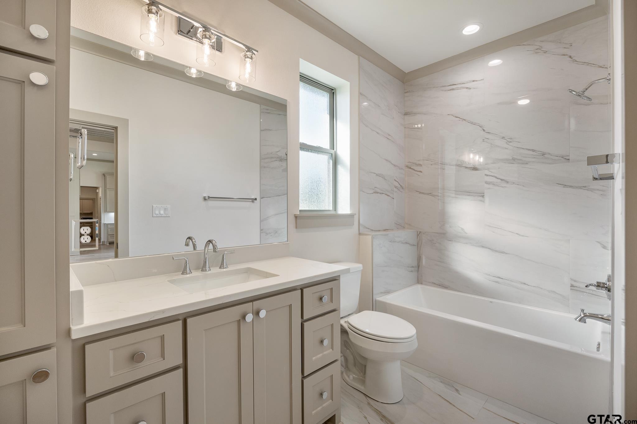 11410 Tucker Circle Flint, TX 75762 - Photo 38 of 43 a bathroom with a sink a toilet and shower