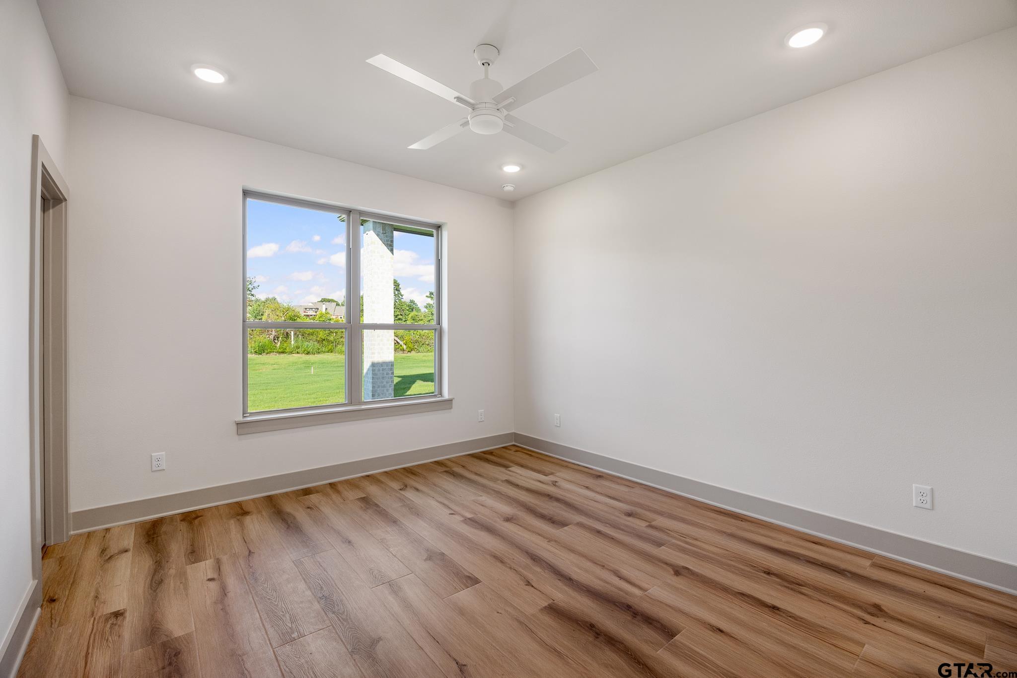 11410 Tucker Circle Flint, TX 75762 - Photo 39 of 43 wooden floor in an empty room with a window