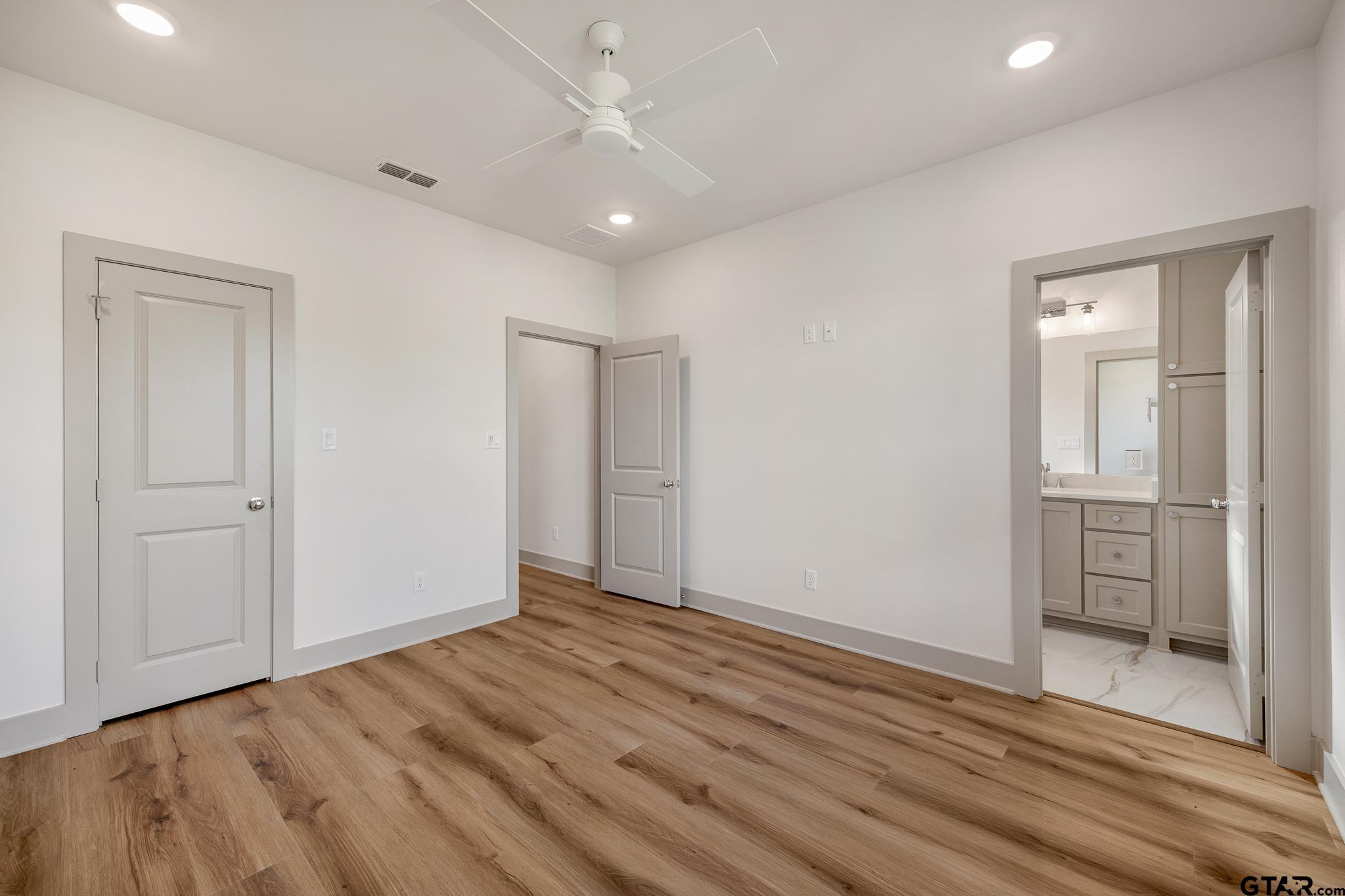 11410 Tucker Circle Flint, TX 75762 - Photo 40 of 43 wooden floor in an empty room with a window