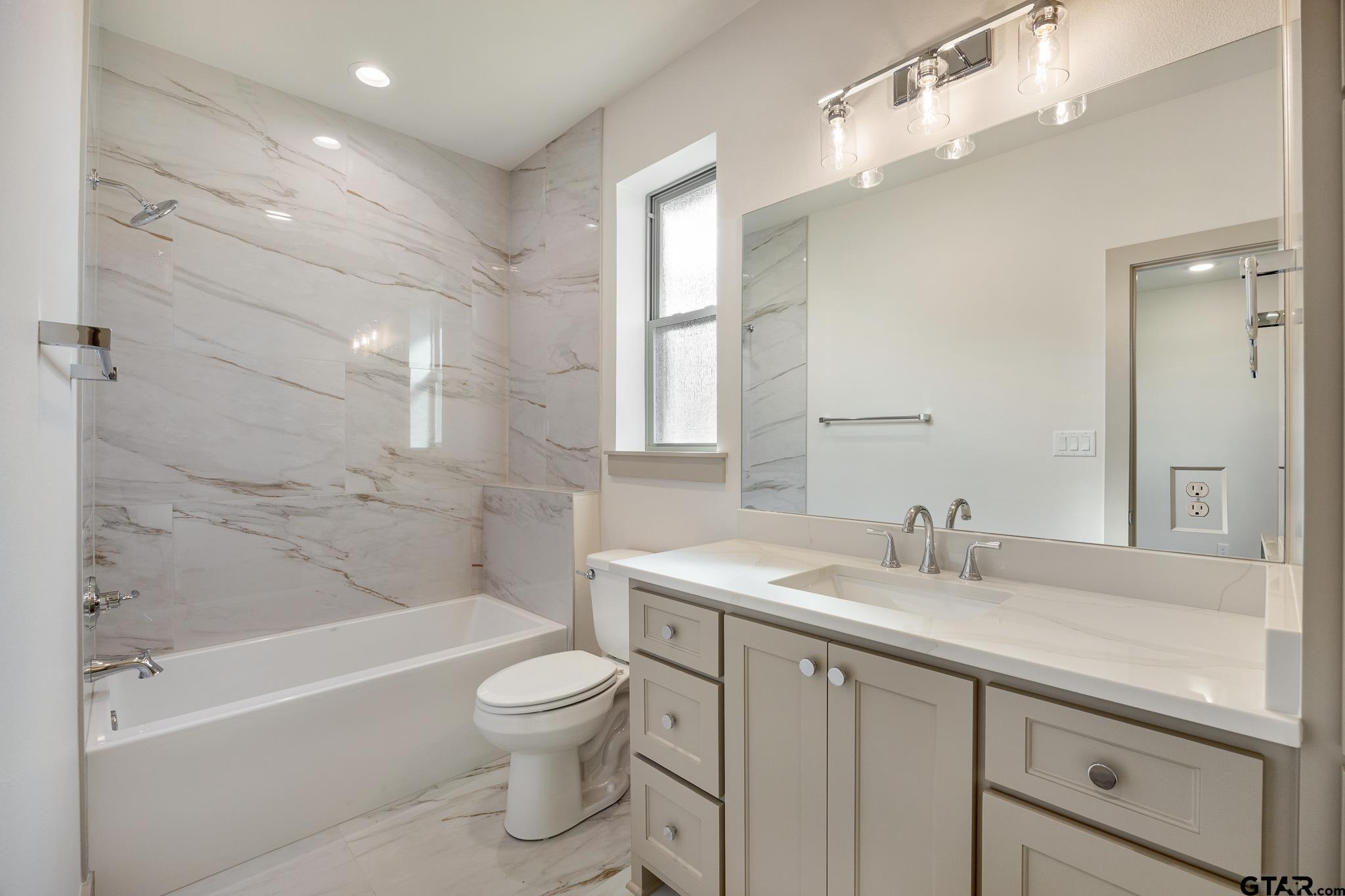 11410 Tucker Circle Flint, TX 75762 - Photo 41 of 43 a bathroom with a sink a toilet and shower