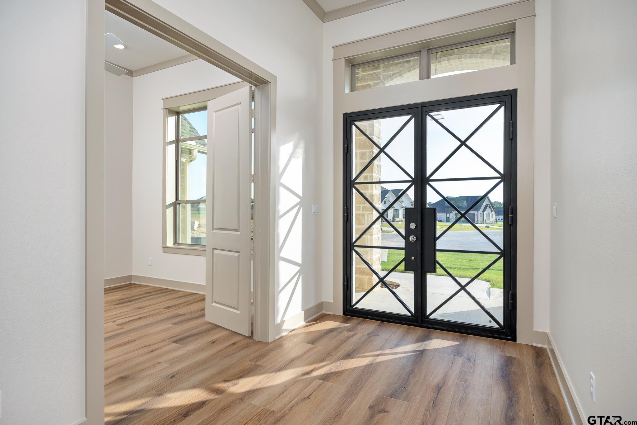 11410 Tucker Circle Flint, TX 75762 - Photo 8 of 43 an empty room with wooden floor and a window