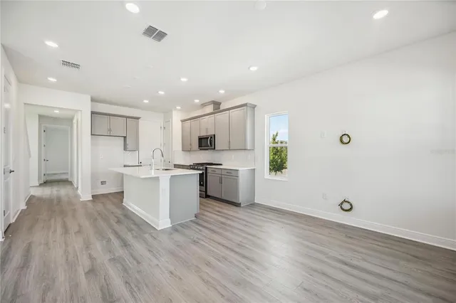 a view of kitchen with wooden floor