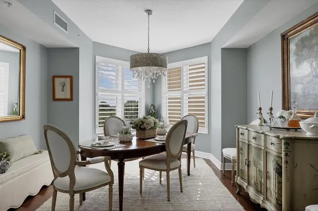 an aerial view of a house with a garden and lake view