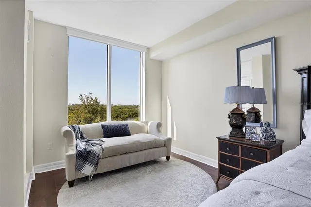 a front view of a house with a garden and plants