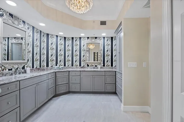 a view of a swimming pool with a patio and a yard