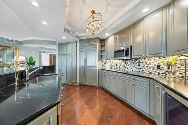 a bedroom with a bed a couch and dresser