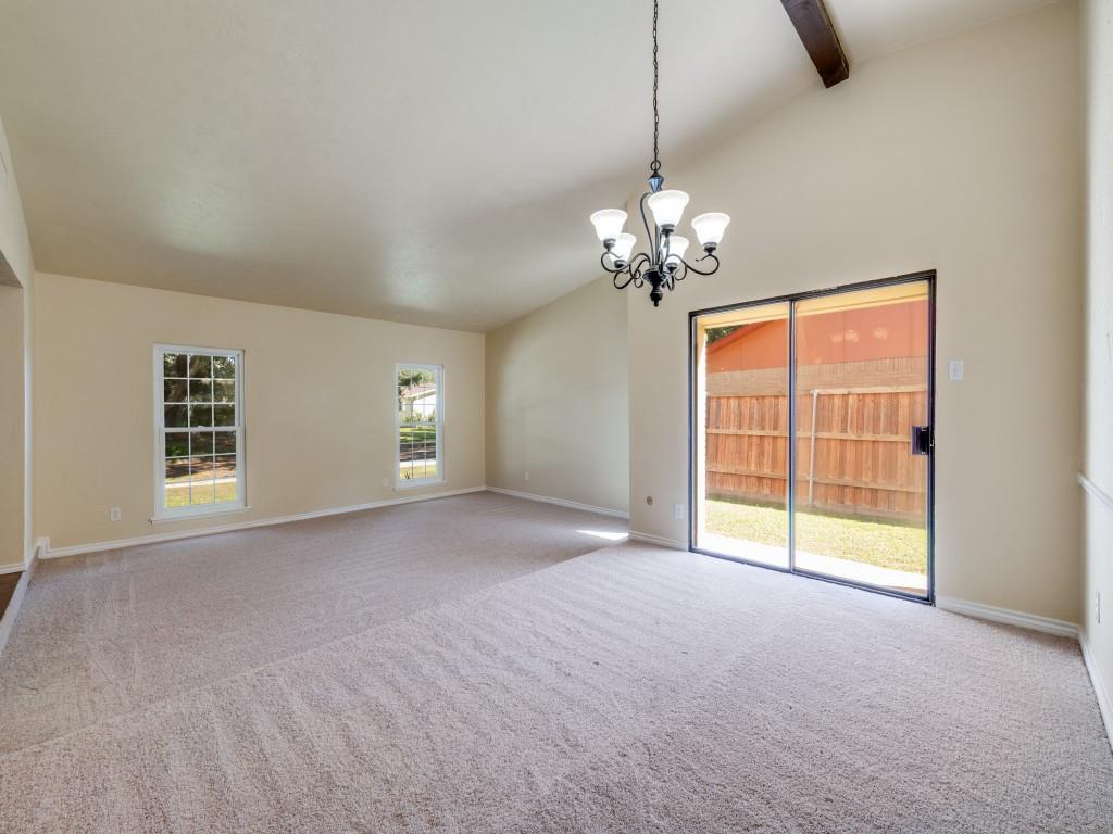 5044 Brandenburg Lane The Colony, TX 75056 - Photo 15 of 33 Dining room facing the formal living. Beamed high vaulted ceiling and decorative chandelier