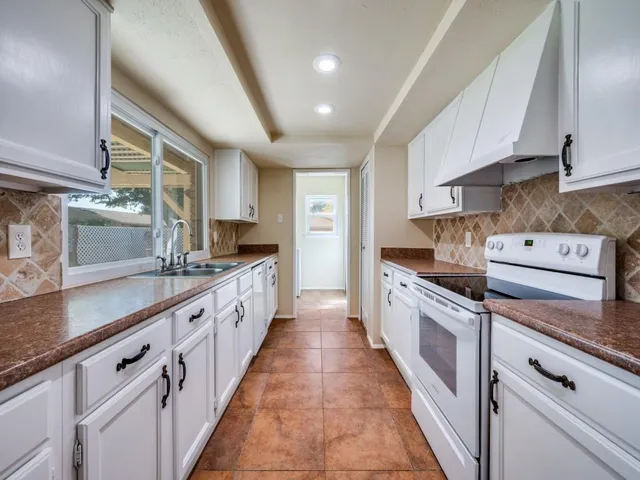 a large kitchen with cabinets