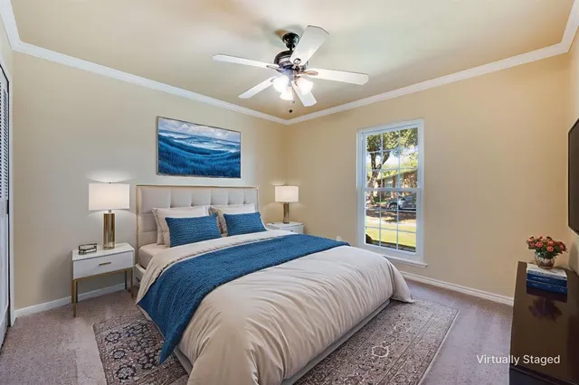 a bedroom with bed and a window