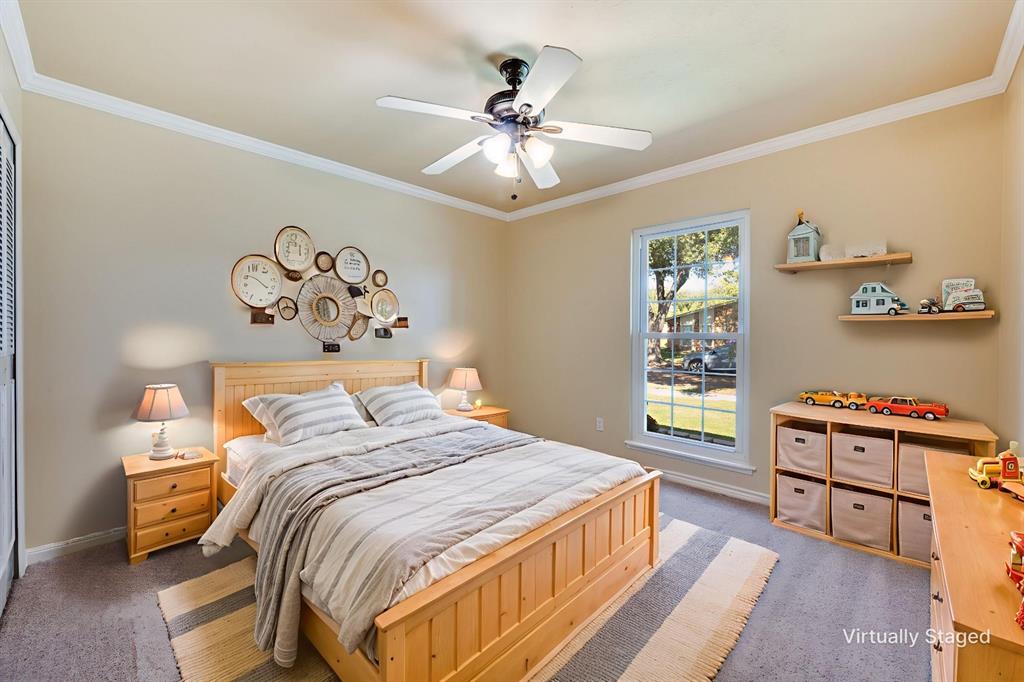 5044 Brandenburg Lane The Colony, TX 75056 - Photo 25 of 33 Bedroom featuring light carpet, crown molding, and ceiling fan