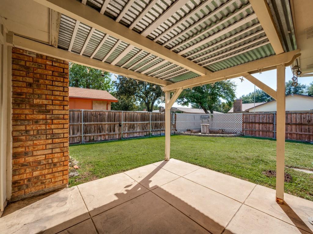 5044 Brandenburg Lane The Colony, TX 75056 - Photo 31 of 33 Fenced backyard featuring a patio area and a pergola. in the corner you will find a planter and wishing well