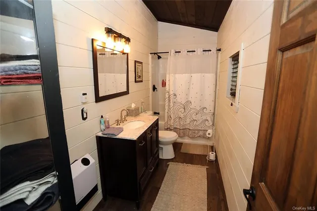 a bathroom with a sink a mirror and a shower
