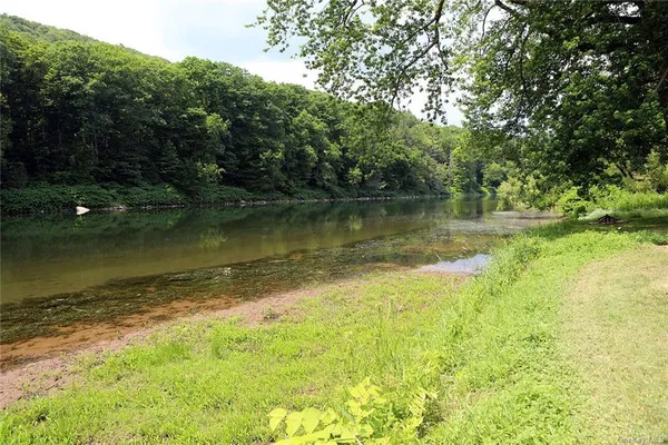 a view of a lake with a yard
