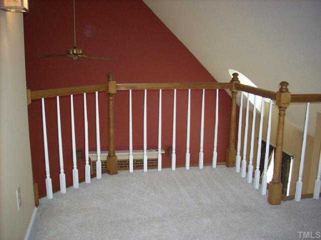 3025 Chippendale Road Raleigh, NC 27604 - Photo 11 of 12 a view of an empty room with stairs
