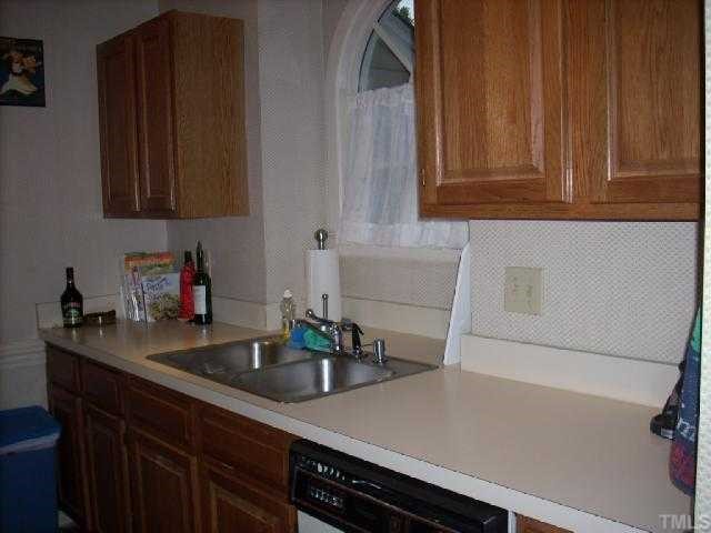 3025 Chippendale Road Raleigh, NC 27604 - Photo 6 of 12 a kitchen with a sink and cabinets