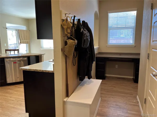 a living room with a bed and a dresser