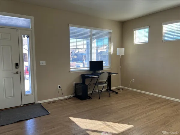 a workspace with wooden floor