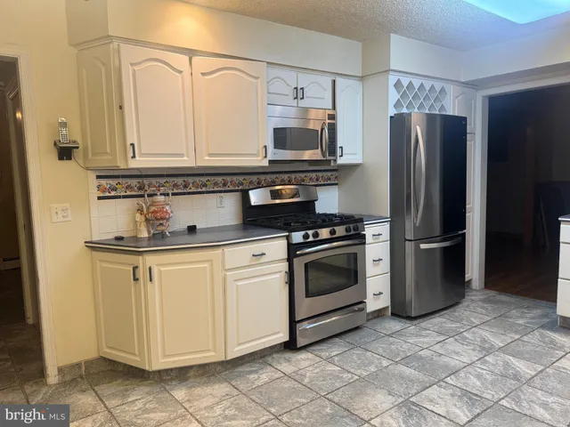 a view of front door with chair and front door