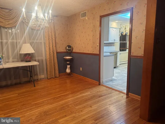 a bathroom with a tub a window and a shower