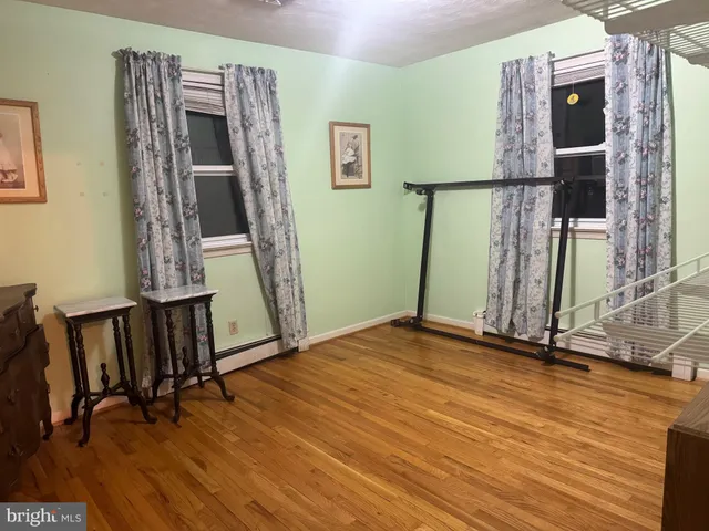a living room with furniture and a lamp