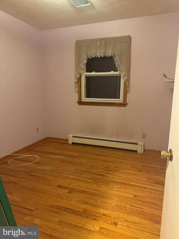 a bathroom with a toilet a sink and a mirror