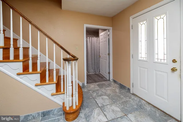a kitchen with a stove a sink and a refrigerator