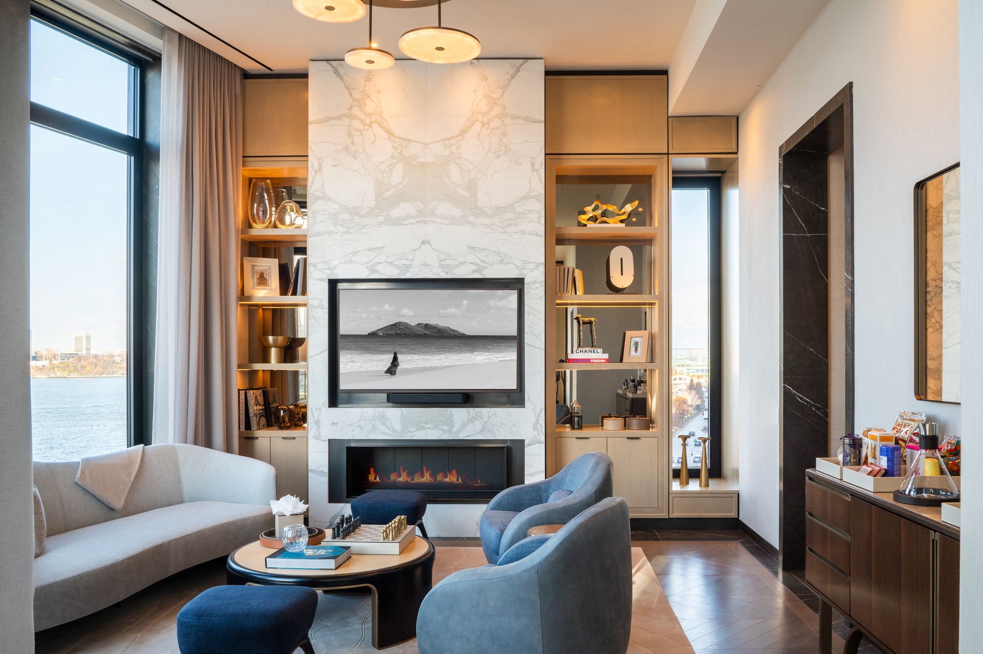 401 West Street, Unit PH Manhattan, NY 10014 - Photo 3 of 23 a living room with furniture and a fireplace