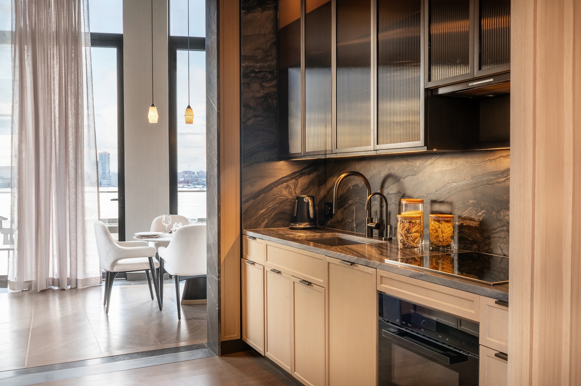 401 West Street, Unit PH Manhattan, NY 10014 - Photo 7 of 23 a kitchen with a refrigerator and a sink