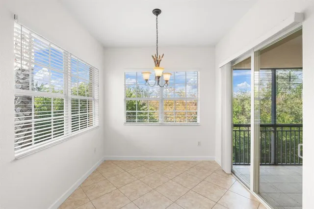 a view of an empty room with windows