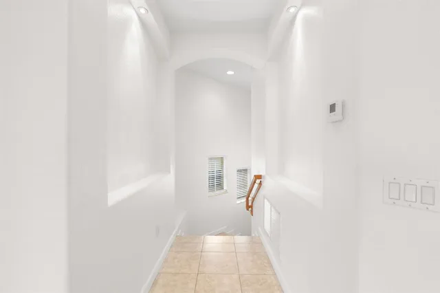 a view of a hallway with a white walls
