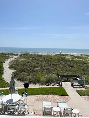 a view of a lake with houses in the back