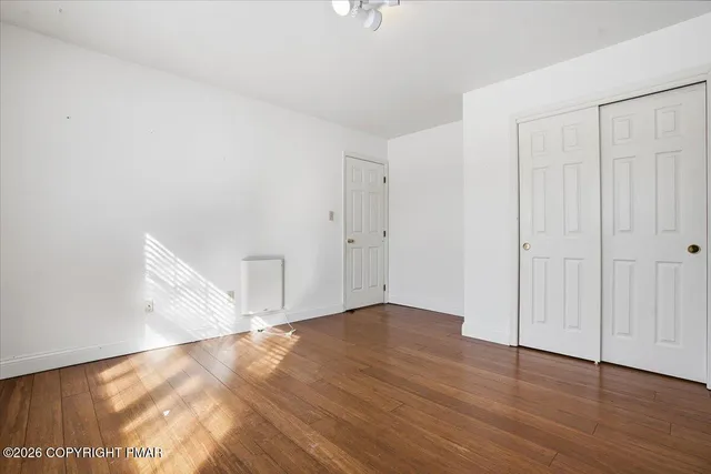 a view of large building with a snow in front of it