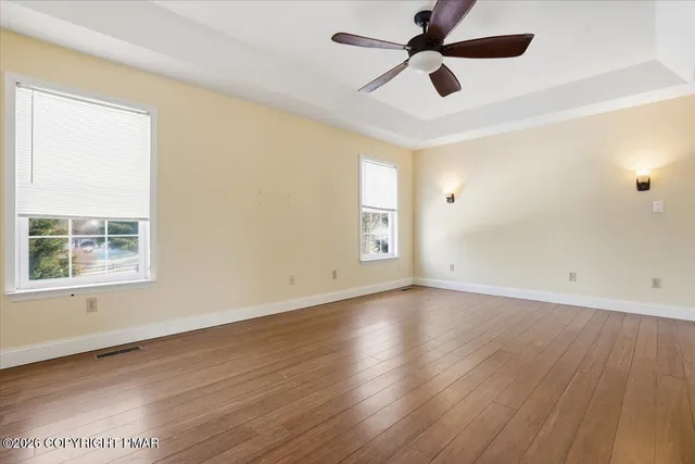 a view of a house with a deck and wooden floor