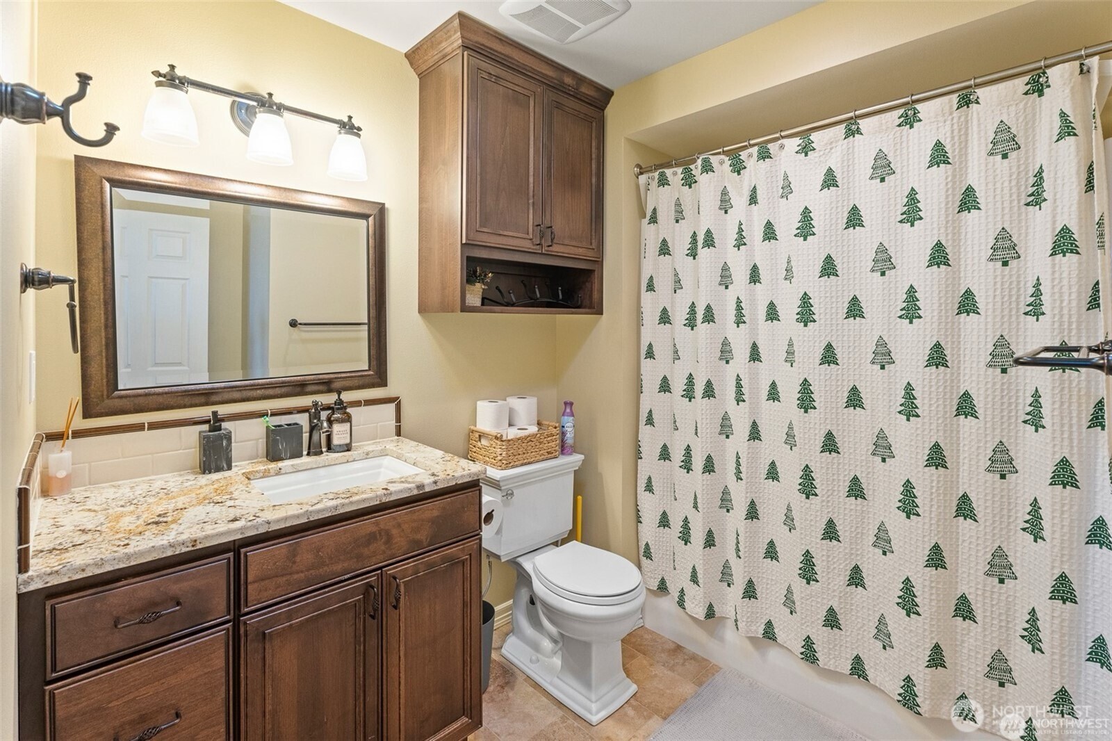 1918 Broadview Wenatchee, WA 98801 - Photo 28 of 38 a bathroom with a granite countertop sink a toilet and a mirror