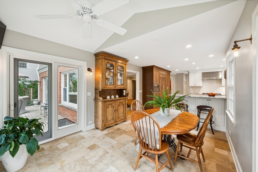 930 Pontiac Road Wilmette, IL 60091 - Photo 11 of 45 a view of a dining room with furniture window and wooden floor