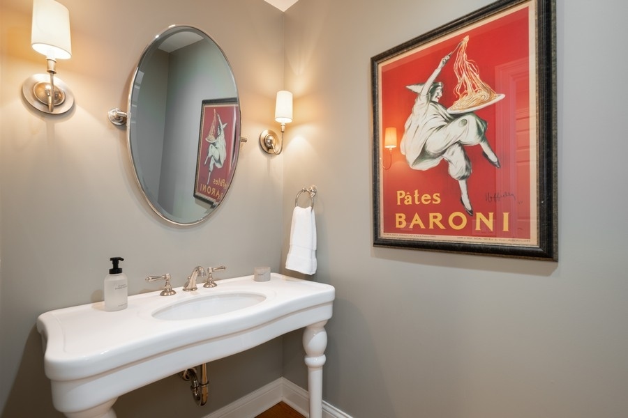 930 Pontiac Road Wilmette, IL 60091 - Photo 12 of 45 a bathroom with a sink and a mirror