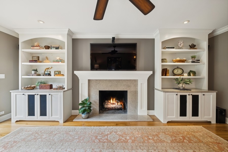 930 Pontiac Road Wilmette, IL 60091 - Photo 14 of 45 a living room with furniture and a fireplace