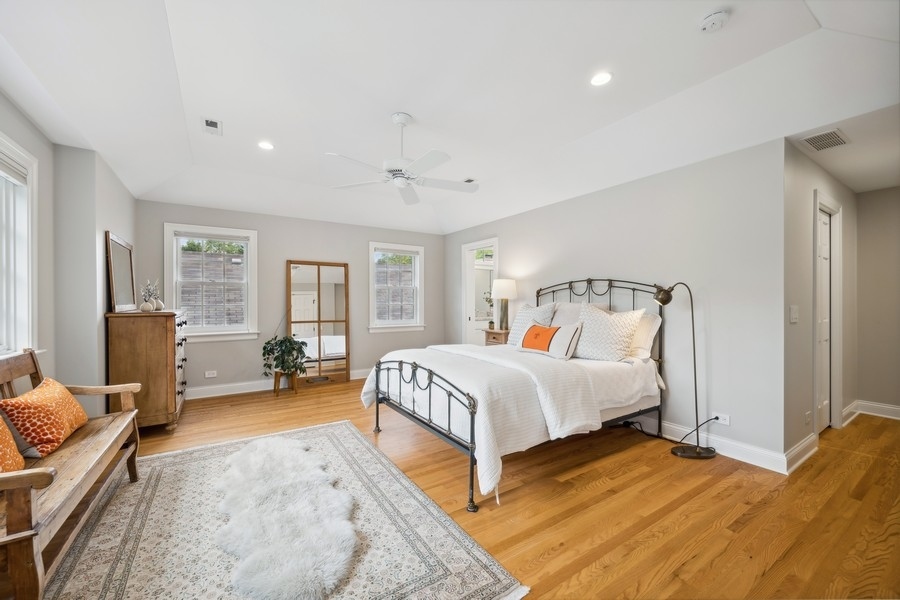 930 Pontiac Road Wilmette, IL 60091 - Photo 17 of 45 a bedroom with a bed and wooden floor