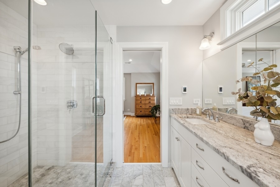 930 Pontiac Road Wilmette, IL 60091 - Photo 20 of 45 a bathroom with a granite countertop sink mirror and shower