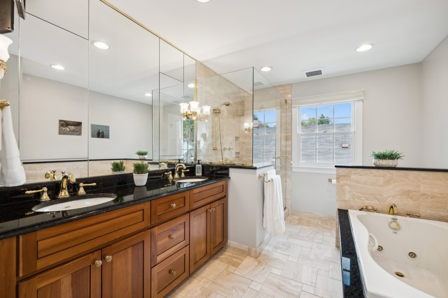 930 Pontiac Road Wilmette, IL 60091 - Photo 30 of 45 a large bathroom with double vanity and a bathtub