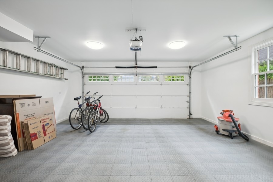 930 Pontiac Road Wilmette, IL 60091 - Photo 37 of 45 a view of a garage with a white car parked