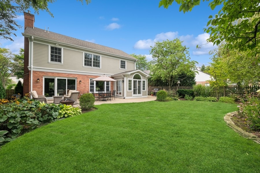 930 Pontiac Road Wilmette, IL 60091 - Photo 39 of 45 a front view of a house with a garden