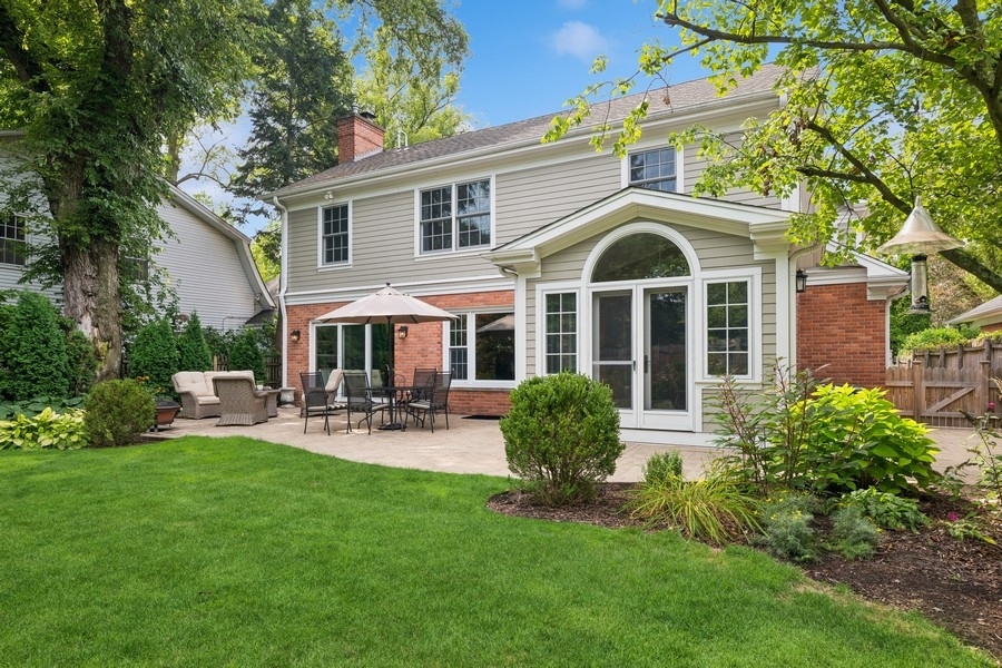930 Pontiac Road Wilmette, IL 60091 - Photo 40 of 45 a front view of a house with patio and garden