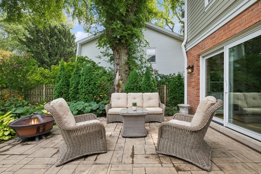 930 Pontiac Road Wilmette, IL 60091 - Photo 41 of 45 a view of a patio with couple of chairs and a fire pit
