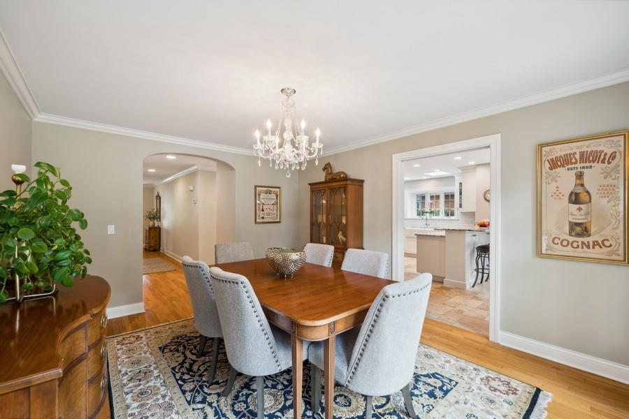 930 Pontiac Road Wilmette, IL 60091 - Photo 6 of 45 a view of a dining room with furniture and chandelier