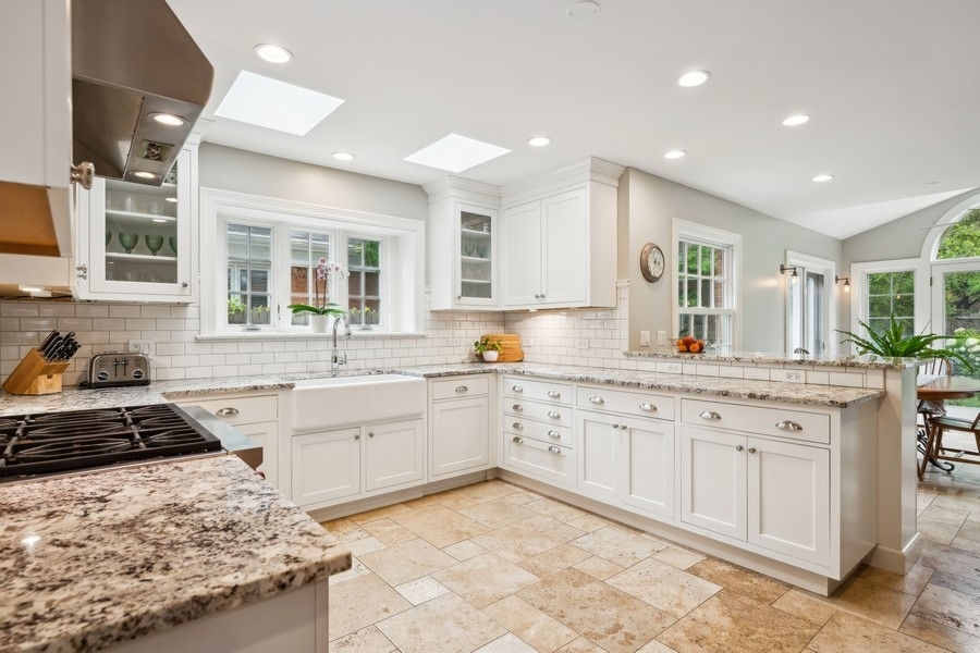 930 Pontiac Road Wilmette, IL 60091 - Photo 7 of 45 a kitchen with granite countertop a sink stove and cabinets