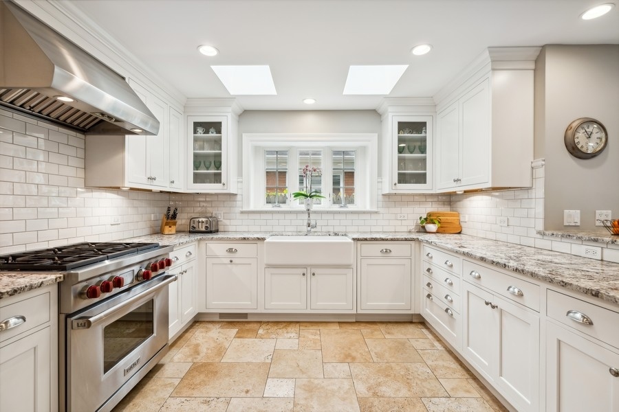 930 Pontiac Road Wilmette, IL 60091 - Photo 9 of 45 a kitchen with a sink stove and cabinets
