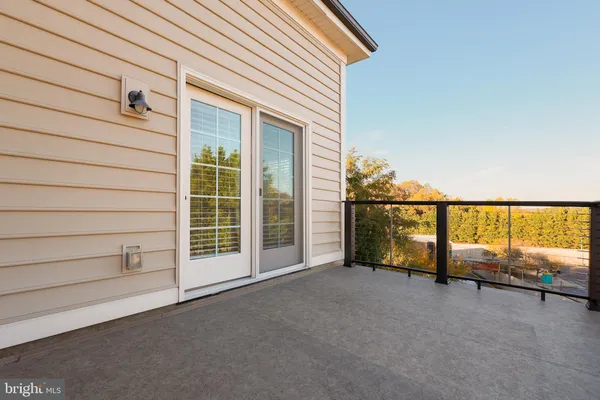 a view of an empty room with a balcony