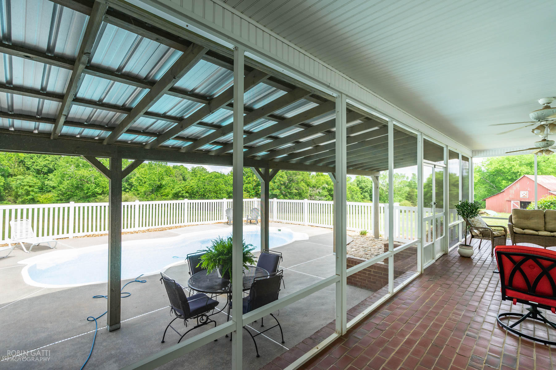 9801 Lower Thomaston Road Macon, GA 31220 - Photo 12 of 40 a view of a porch with furniture and a backyard